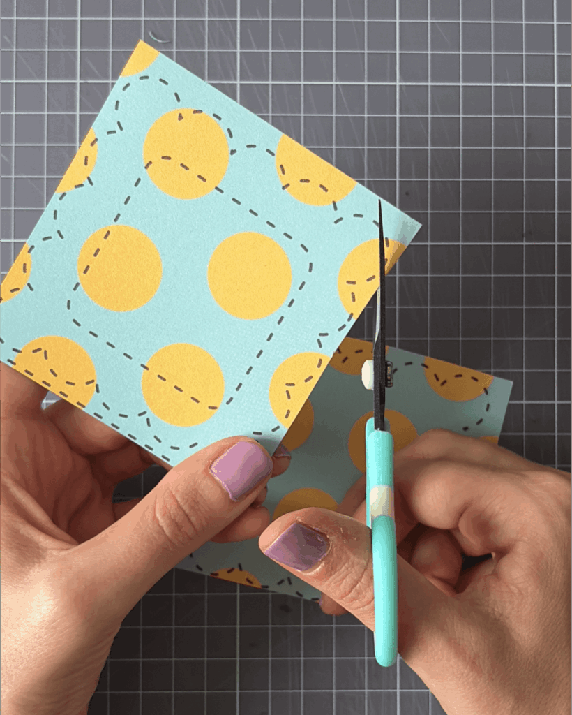 Carefully cut out the frames and quotes using scissors or a craft knife.