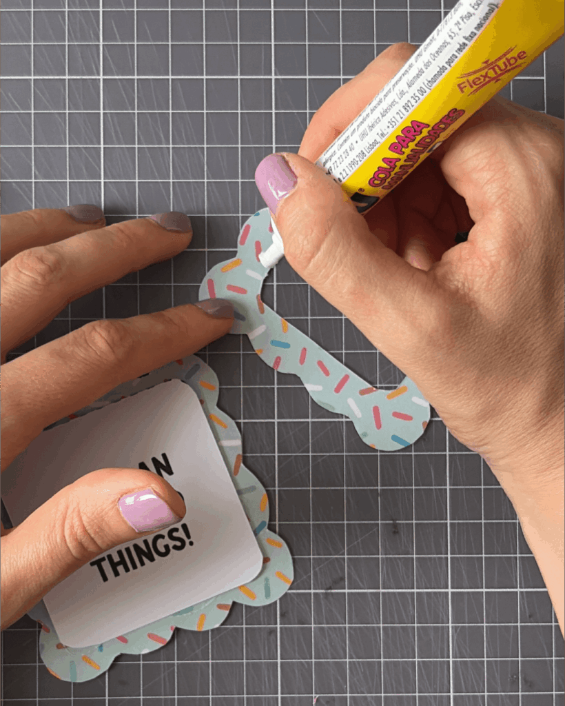 Glue your chosen designs behind the frames.